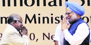 Outgoing CJI KG Balakrishnan greets PM Manmohan Singh at a law conference in New Delhi.