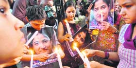 A candle-light vigil being held in Delhi to seek justice for Nirupama Pathak.
