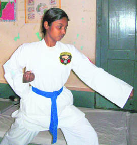  Asma conducts training sessions in karate to earn her livelihood
