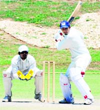 A batsman plays a shot at the Cricket Stadium in Sector 16, Chandigarh, on Sunday.