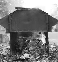 Garbage being burnt inside a municipal council dustbin kept near Saini Bhawan at Dera Bassi.