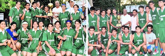 The girls team receive the trophy after winning the Espen Crew Uttarakhand Girls Basketball Championship in Dehradun on Sunday and (right) the Dehradun district boys team take the trophy. 