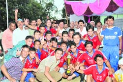The Eleven Star team rejoice after lifting the RB Singh Memorial Football Tournament in Dehradun on Sunday. 