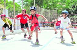 Participants perform at the Inter-School Roller Skating Tournament in Dehradun on Sunday.