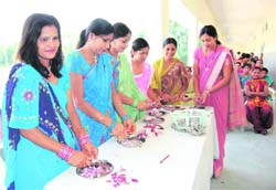 Mothers of schoolchildren prepare dishes in a school in Haridwar.