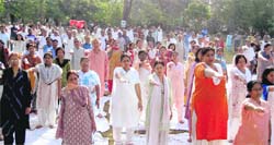 Participants at an Art of Living programme take a pledge against polythene use in Dehradun on Sunday.