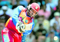West Indies Chris Gayle plays a shot at the Kensington Oval on Sunday