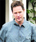 Britain's Liberal Democrats party leader Nick Clegg walks out from his house in London to speak to the media