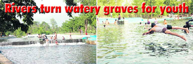 Youth enjoy a swim at the Lacchhiwala tourist resort near Dehradun.