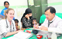  Dr DS Rawat, senior paediatrician, with a trainee doctor from the Netherlands at the Doon Hospital on Monday. A Tribune photograph
