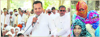 Congress MP Naveen Jindal addresses the Sarv Jati Sarv Khap Mahapanchayat in Kaithal on Monday; and (right) a small group of women huddled into a corner at the khap meeting.