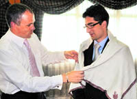 Chief Minister Omar Abdullah felicitates IAS topper Dr Shah Faesal in the Civil Secretariat in Srinagar on Monday