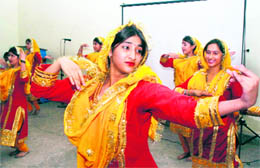 Students perform during a prize distribution function of the NCC at Deewan Badri Nath School at Talab Tillo in Jammu on Monday