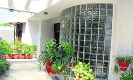 Maroon colour tones, the outer facade in glass