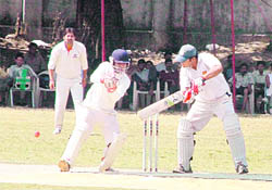 A batsman plays a shot at the All-India Uttarakhand Gold Cup Cricket Tournament in Dehradun on Tuesday.
