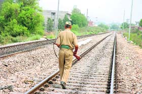 COP ON TRACK: A policeman guards a railway line in Jammu