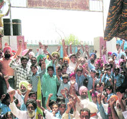Residents of Bhai Bakhtaur village stage a protest outside the gate of the high school against the appointment of contractual teachers on Wednesday.