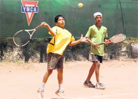 Players in action during a tennis match in Mohali