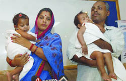 Sita and Gita with their parents