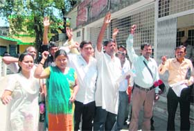 Members of the Kamgaar Kalyan Samiti hold a protest in Dehradun