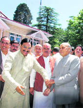 Dr Ramesh Pokhriyal Nishank, Chief Minister of Uttarakhand, being welcomed by Himachal Chief Minister Prem Kumar Dhumal (right) during a national seminar on Bhartiya Swasthya Chintan at Shimla on Wednesday.