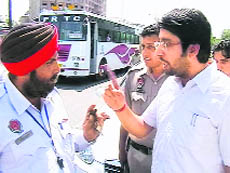 Amit Gosain and head constable argue with each other at the Bhai Bala Chowk in Ludhiana on Wednesday.