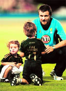 Dirk Nannes with his children after the Super Eight match against West Indies on Tuesday