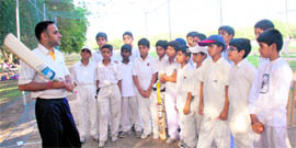 Former HP Ranji Trophy cricketer Rajiv Nayyar giving tips to budding cricketers at the St. Johns Cricket Academy, Chandigarh. Nayyar has been appointed as cricket coach at Saint Johns High School, sector 26 here