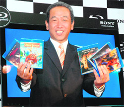 Managing Director, Sony India, Masaru Tamagawa poses with Blu-ray discs at the launch of Sony Blu-ray disc player in New Delhi on Thursday.