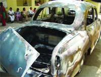 A car of Delhis Lieutenant Governor security personnel was damaged in a fire near Tis Hazari Courts on Thursday in New Delhi.