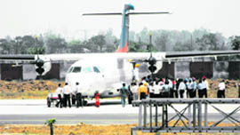Leaders and their supporters alight from the first commercial flight from Delhi at Sahnewal airport