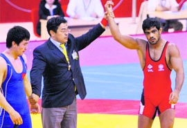 Sushil Kumar (R) declared winner in New Delhi on Thursday.