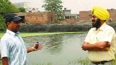 A team of NGO Mission Aagaaz visits Muradpura village on Fatehgarh Churian Road where toxic fly ash is dumped into the pond.