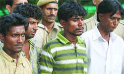 The accused in police custody.