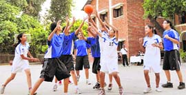 A girls match in progress at the District Sub-Junior (U-14) Basketball Championship in Dehradun on Friday. 
