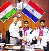 Nizam Ali (centre) and Santosh Kumar (extreme right) of Uttarakhand Police meet DGP Subhash Joshi in Dehradun on Thursday.