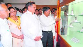 Dr Yoganand Shastri, Speaker of Delhi Legislative Assembly, looks at the artifacts on display at the Gurukul Kangri University museum in Haridwar on Friday.