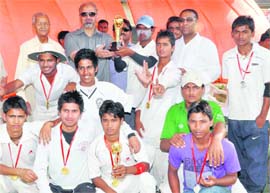 The Rajendra Sports Cricket team receives the trophy after winning the Second Babu Farid Ahmed Memorial Cricket Tournament in Dehradun on Friday.