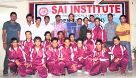 Saurabh Tiwary (in centre with long hair) with Sai Institute students at a function in his honour in Dehradun on Friday.