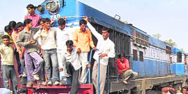  Villagers stop a  train at Suchan village in Sirsa on Friday.