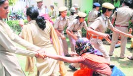 Police disperses teachers protesting outside the residence of Rajasthan Education Minister Bhanwarlal Meghwal in Jaipur on Friday.