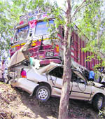 The mangled remains of a car which was involved in an accident with a truck near Amritsar