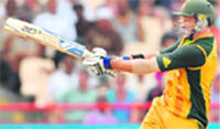 Australian cricketer Mike Hussey plays a shot
