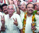 Delhi BJP president Vijender Gupta with outgoing state unit chief O.P. Kohli and supporters at the partys office in New Delhi on Saturday.