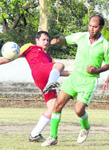 Players in action at the Second Institutional League Football Tournament in Dehradun on Saturday.