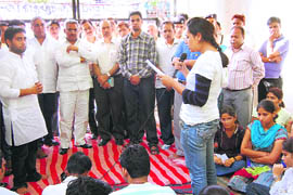 A student reads out a letter of demands in the presence of state Urban Development Minister Madan Kaushik at Rishikul Medical College in Haridwar on Saturday. 