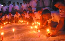 Jawans lighting candles during the 27th International AIDS Candlelight Memorial, at the ITBP Centre in Bathinda on Sunday evening. 