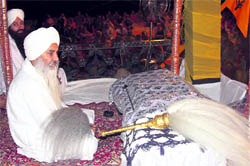 Mahant Manjeet Singh of Dera Nangali Sahib (Poonch) delivers sermons to devotees who participated in the Sirhind Fateh Diwas celebrations organised by Gurmat Samagam at Sant Mela Singh College of Education, Digiana, Jammu, on Sunday