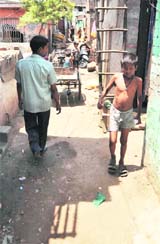 A boy walks through a narrow lane at a colony in Ludhiana.