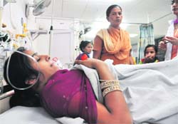 Manjit Kaur recuperating at the GTB Hospital in Ludhiana on Sunday. 